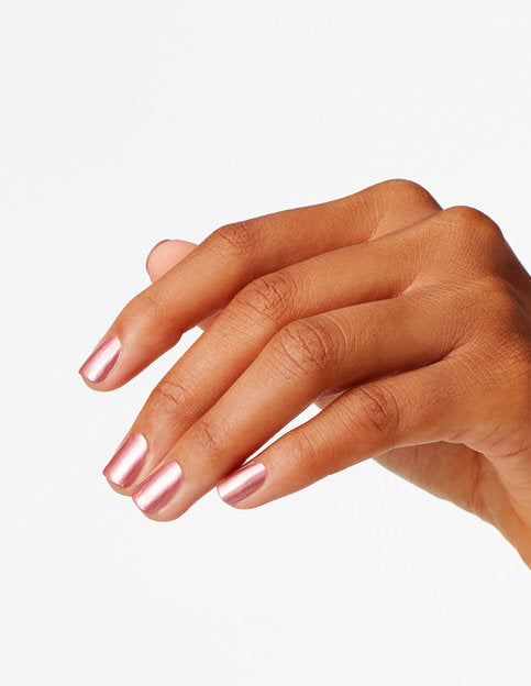 hands wearing S63 Chicago Champagne Toast Nail Lacquer by OPI