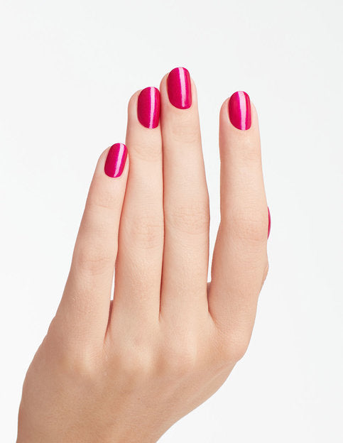 hands wearing B31 Flashbulb Fuchsia Gel Polish by OPI