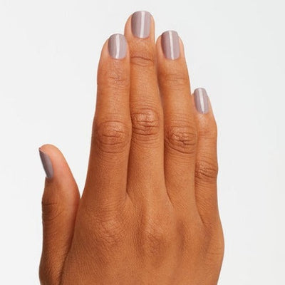 hands wearing A61 Taupe-less Beach Trio by OPI