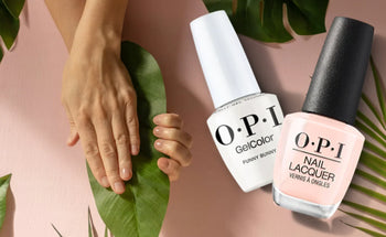 OPI Funny Bunny and soft pink OPI nail polish with neutral manicure on natural nails and green leaf background