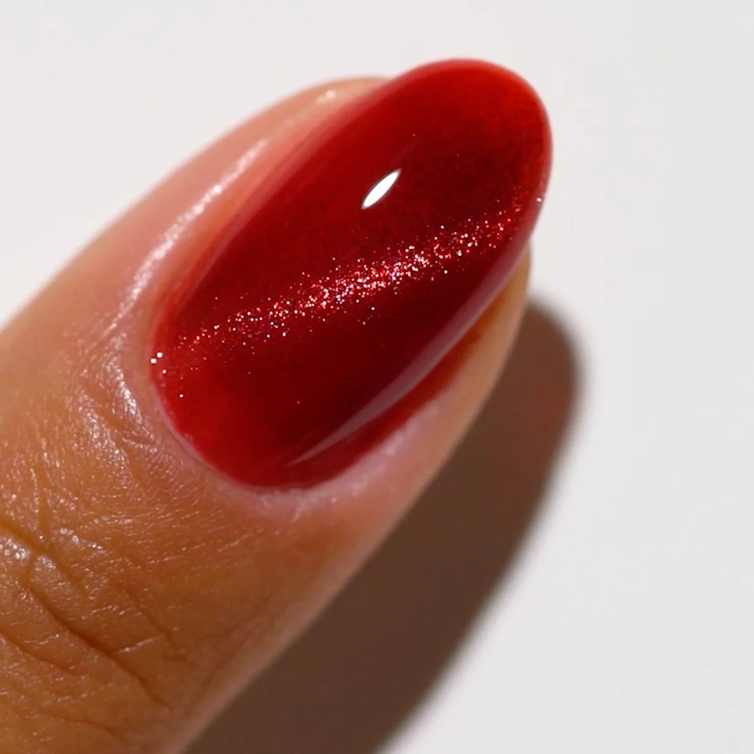 finger wearing DND DC Cat Eye Wine N’ Lust