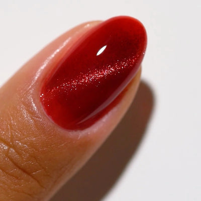 finger wearing DND DC Cat Eye Wine N’ Lust