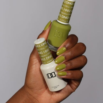 Hands wearing 1002 Jukebox Olive Gel & Polish Duo by DND