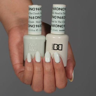 Hands wearing 968 Head In The Clouds Gel & Polish Duo by DND