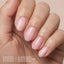 Model wearing Aprés Soft Gel Builder Gel Swoon, featuring soft sheer pink clean girl nails with a glossy structured gel manicure.