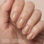 Model wearing Aprés Soft Gel Builder Gel Touch, featuring warm beige nude clean girl nails with a glossy structured gel manicure.