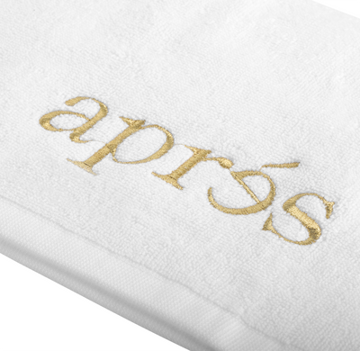 gold logo on the White Hand Towel by Apres