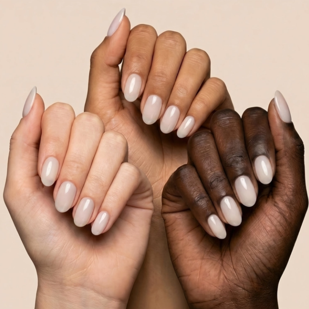 Aprés Soft Gel Builder Gel Whisper showcased on multiple skin tones, featuring milky white clean girl nails with a natural glossy finish and structured gel manicure.