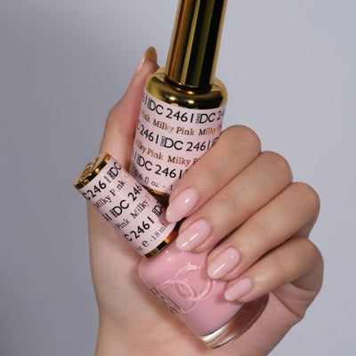 hands wearing 2461 Milky Pink Gel & Polish Duo by DND DC