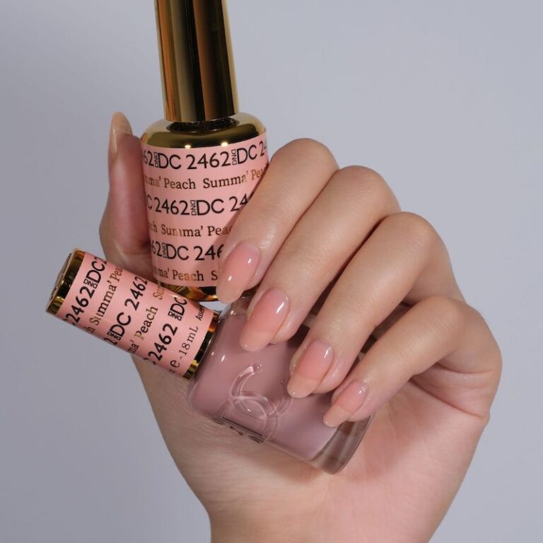 hands wearing 2462 Summa' Peach Gel & Polish Duo by DND DC