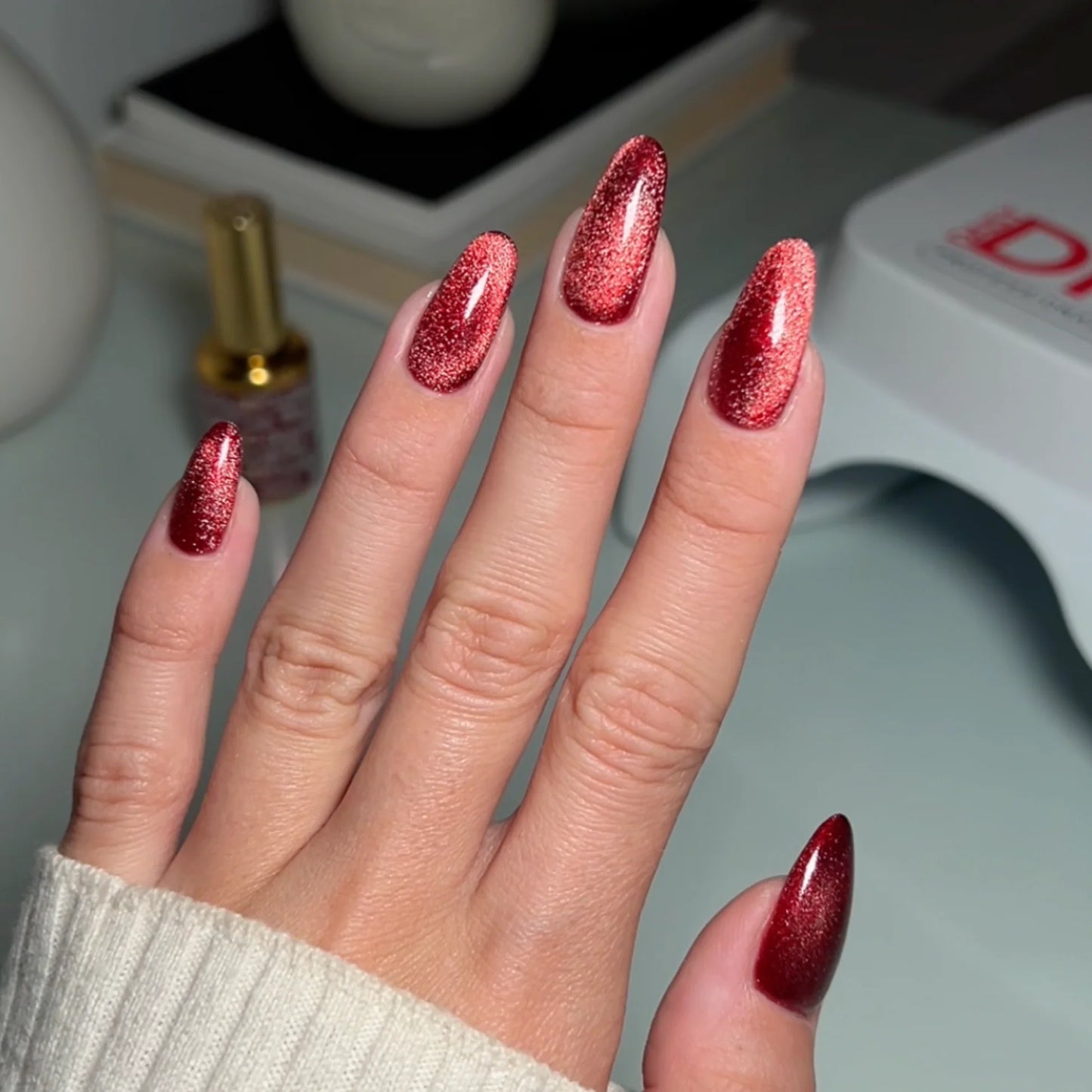 hands wearing DND DC Cat Eye Wine N’ Lust