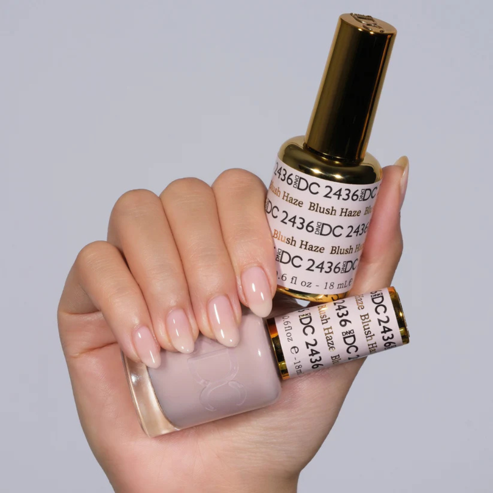 Hands wearing DND DC Gel 2436 Blush Haze