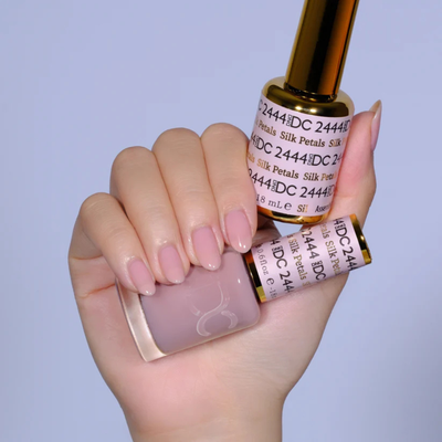 Hands wearing DND DC Gel 2444 Silk Petals