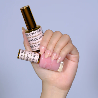 Hands wearing DND DC Gel 2445 Be My Muse