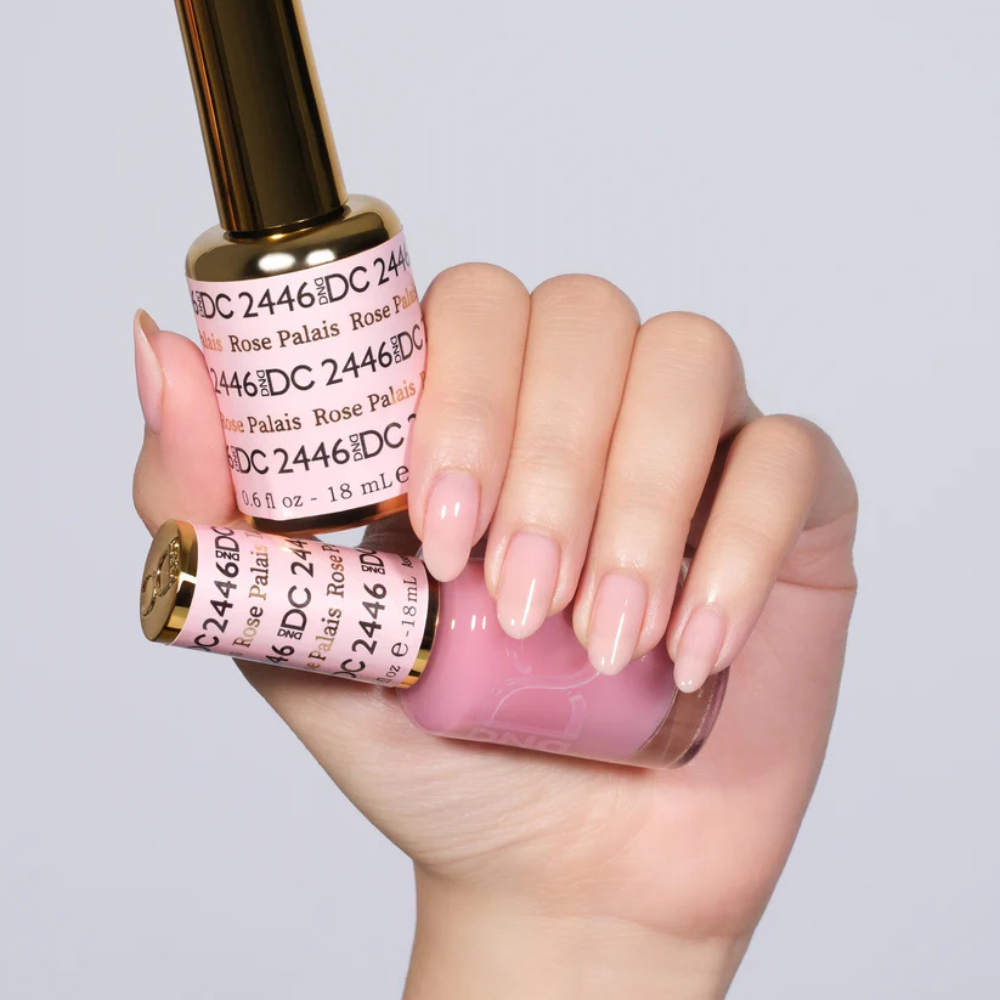Hands wearing DND DC Gel 2446 Rose Palais