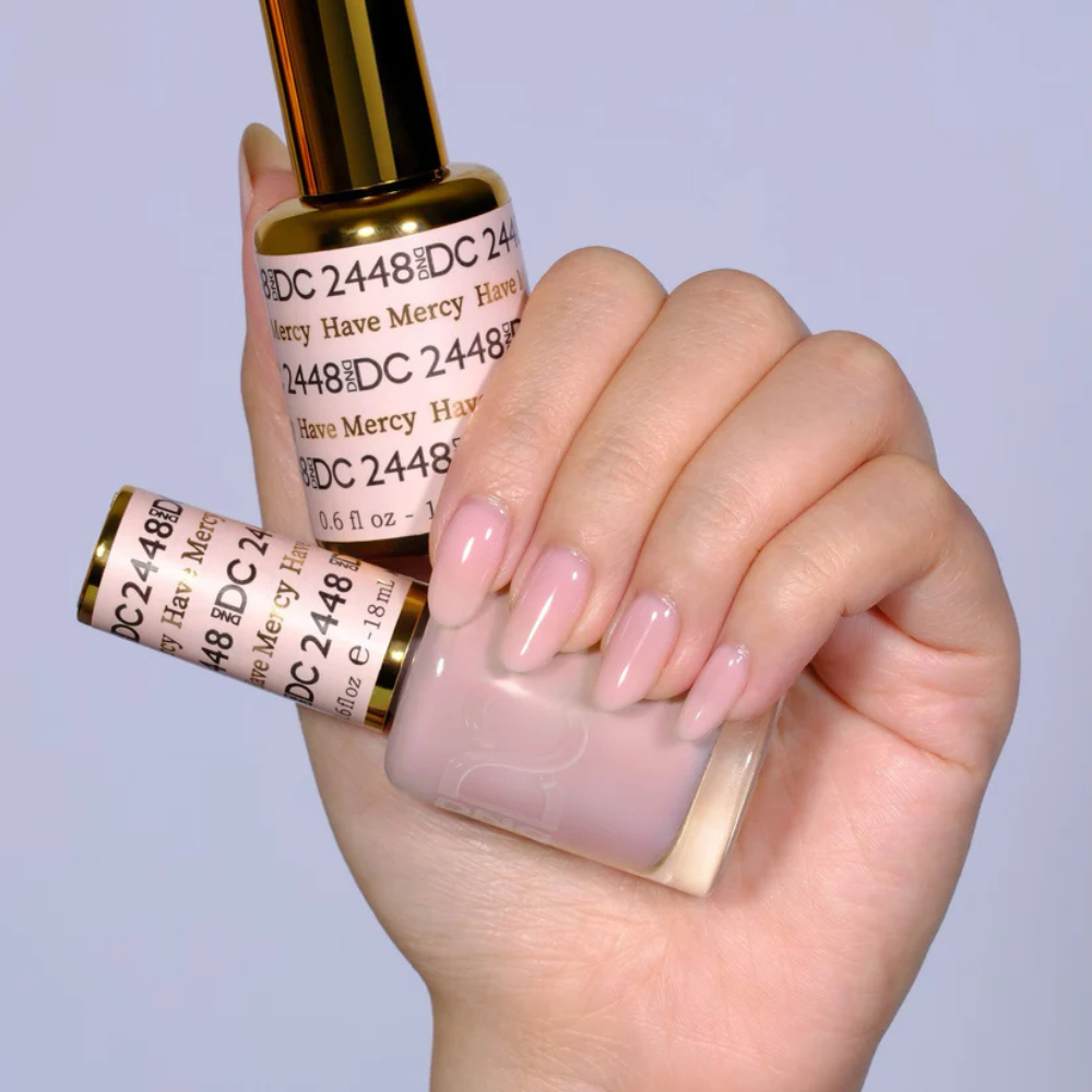 Hands wearing DND DC Gel 2448 Have Mercy