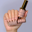 Hands wearing DND DC Gel 2457 Cashmere