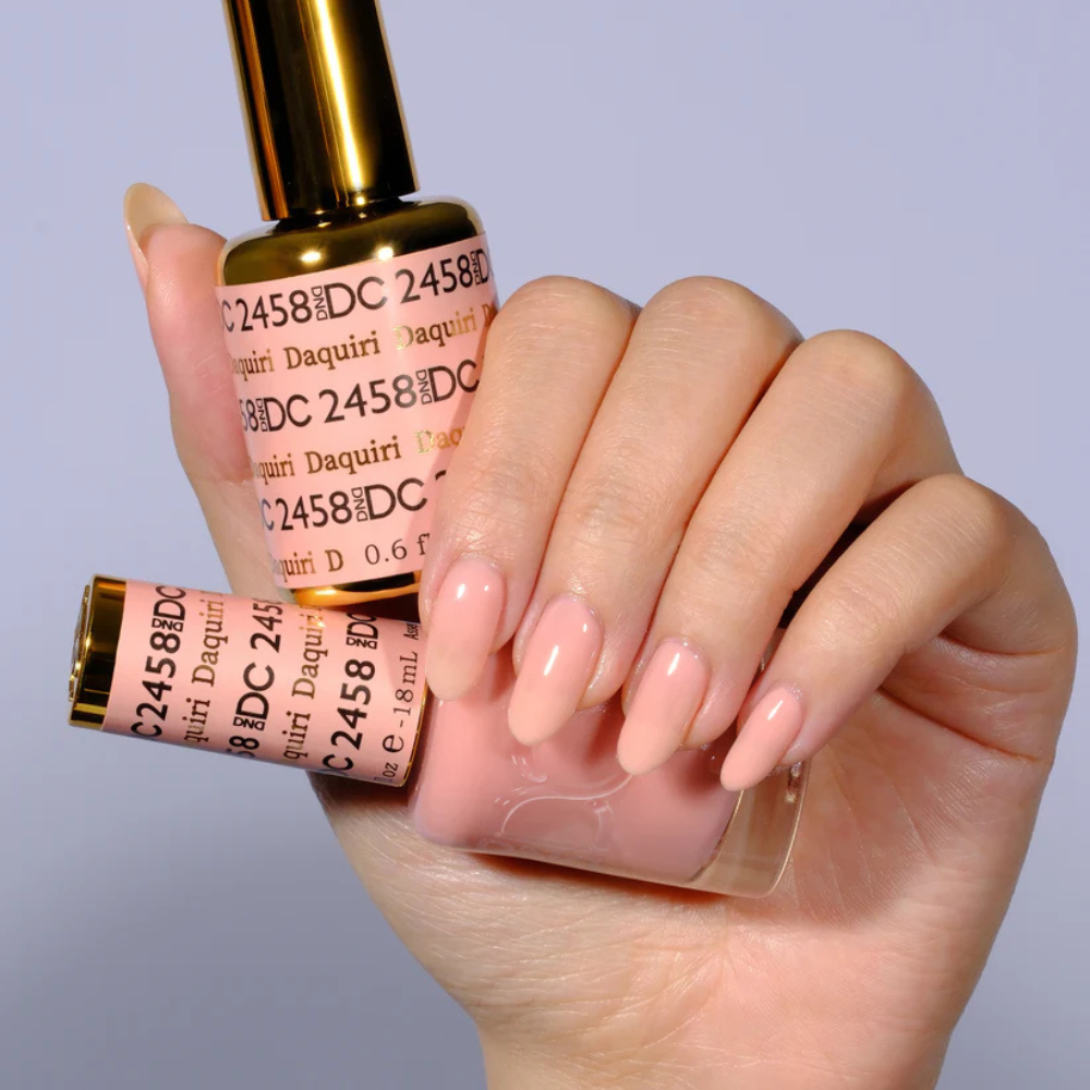 Hands wearing DND DC Gel 2458 Daiquiri