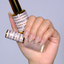 Hands wearing DND DC Gel 2459 Barefoot