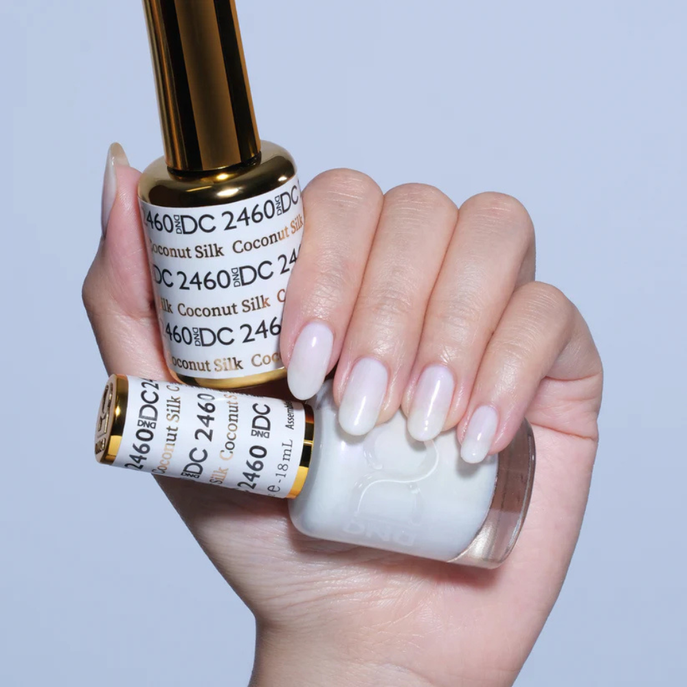 Hands wearing DND DC Gel 2460 Coconut Silk