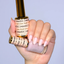 Hands wearing DND DC Gel 2466 Fresh Linen