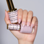 Hands wearing DND DC Gel 2470 Gloss Moon