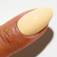 Hands wearing DND DC Gel 2509 Gimmie' Butter