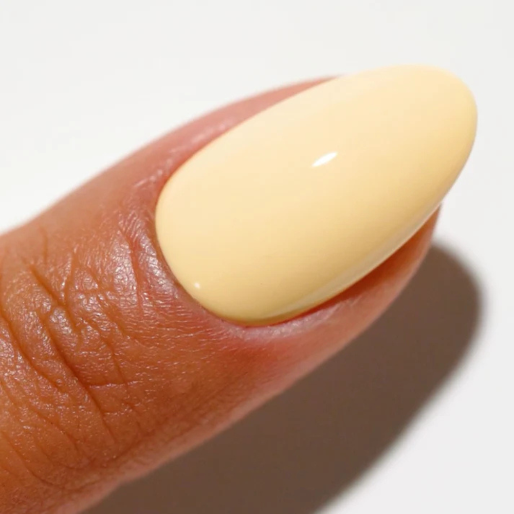 Hands wearing DND DC Gel 2509 Gimmie' Butter