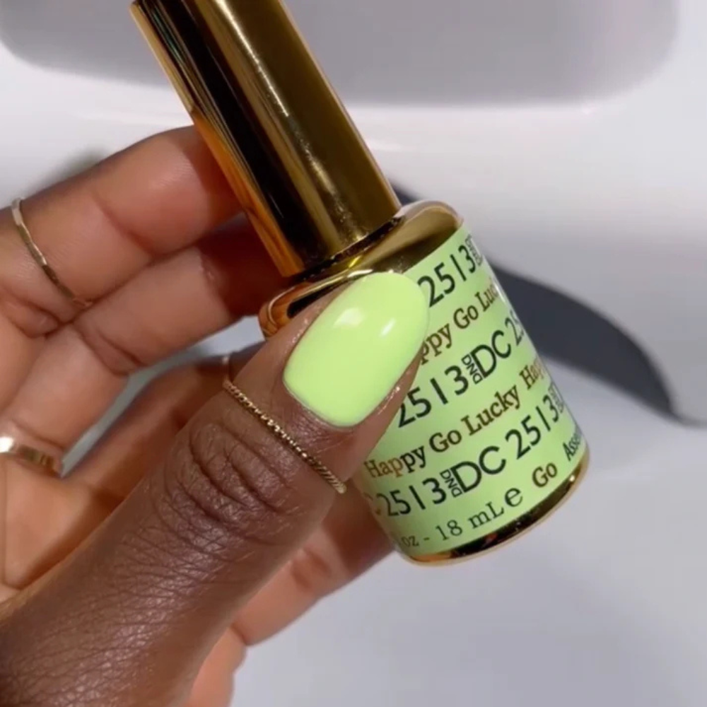 Hands wearing DND DC Gel 2513 Happy Go Lucky