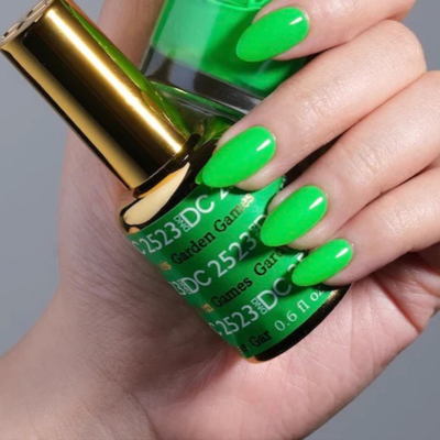 Hands wearing DND DC Gel 2523 Garden Games