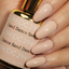Hands wearing DND DC Gel 294 Sand Dance