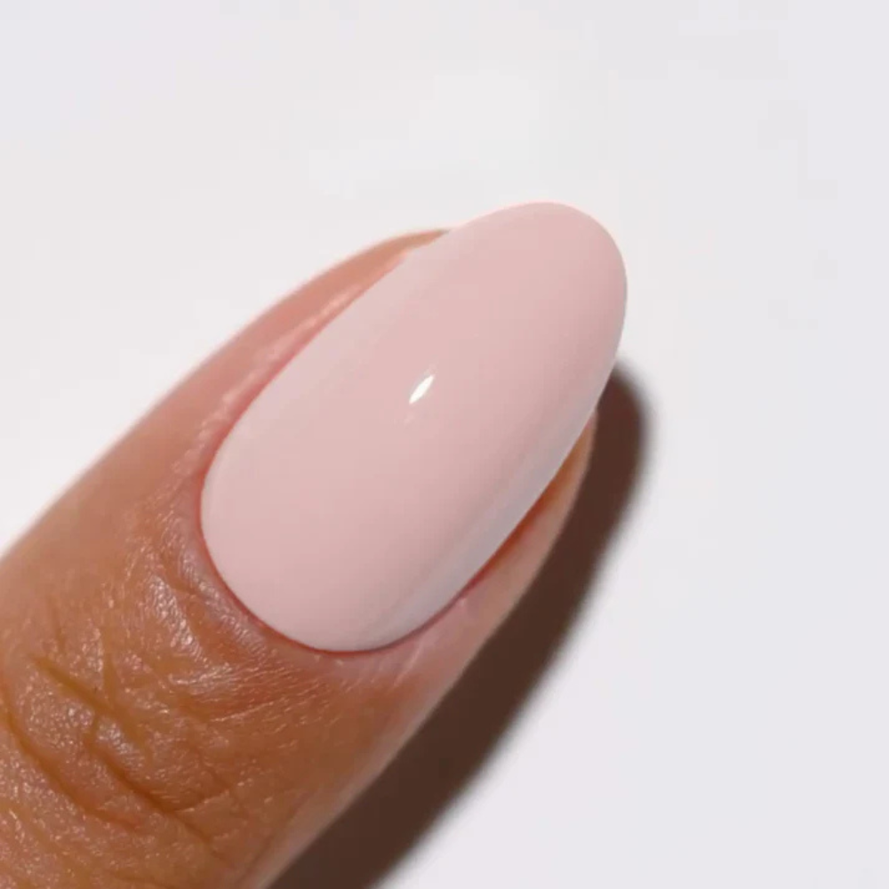 Hands wearing DND DC Gel 298 Genuine Pink