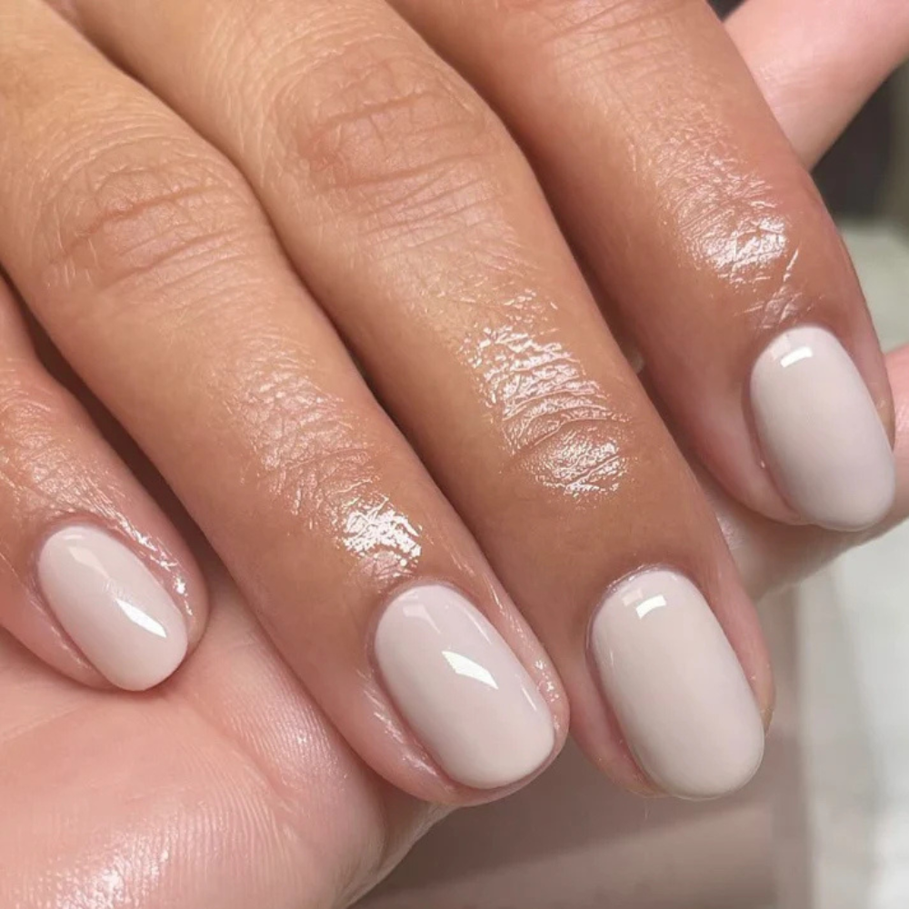 Hands wearing DND DC Gel 301 Half Moon