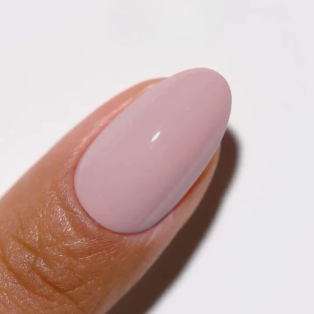 Hands wearing DND DC Gel 302 Blush Village