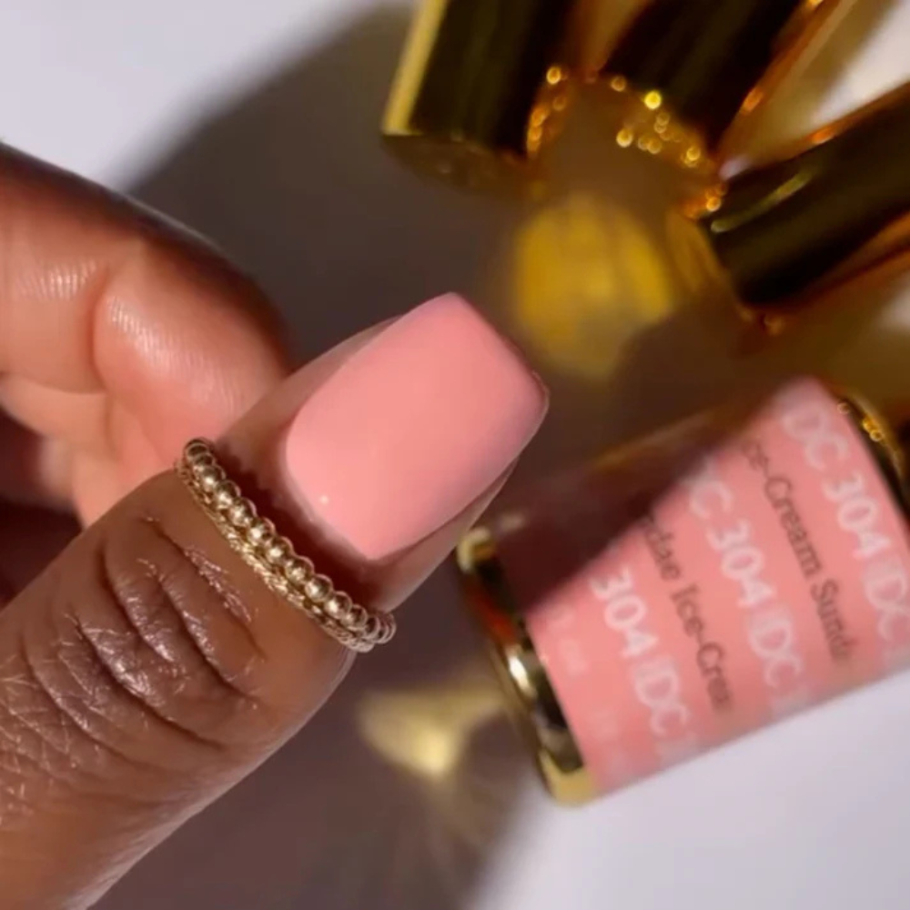 Hands wearing DND DC Gel 304 Ice-Cream Sundae