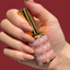 Hands wearing DND DC Gel 307 Cinnamon Craze