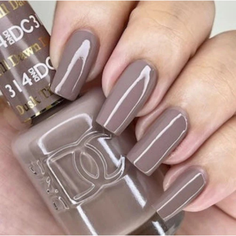 Hands wearing DND DC Gel 314 Dusk Till Dawn