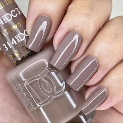 Hands wearing DND DC Gel 314 Dusk Till Dawn