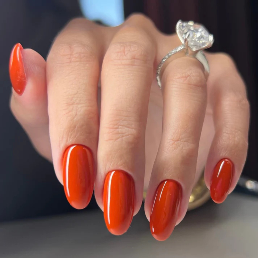 Hands wearing DND DC Gel 318 Cherry Pie