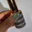 Hands wearing DND DC Gel 323 Vintage