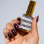 hands wearing DND DC181 Mahogany Platinum