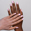 hands wearing 116 Pastel Lily Gel & Polish Diva Duo by DND