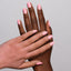 hands wearing 134 Bubblegum Bliss Gel & Polish Diva Duo by DND