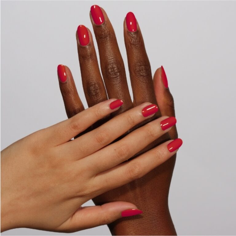 hands wearing 162 Rebel Red Gel & Polish Diva Duo by DND