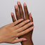 hands wearing 164 Peach Waffle Diva Gel & Polish Duo by DND