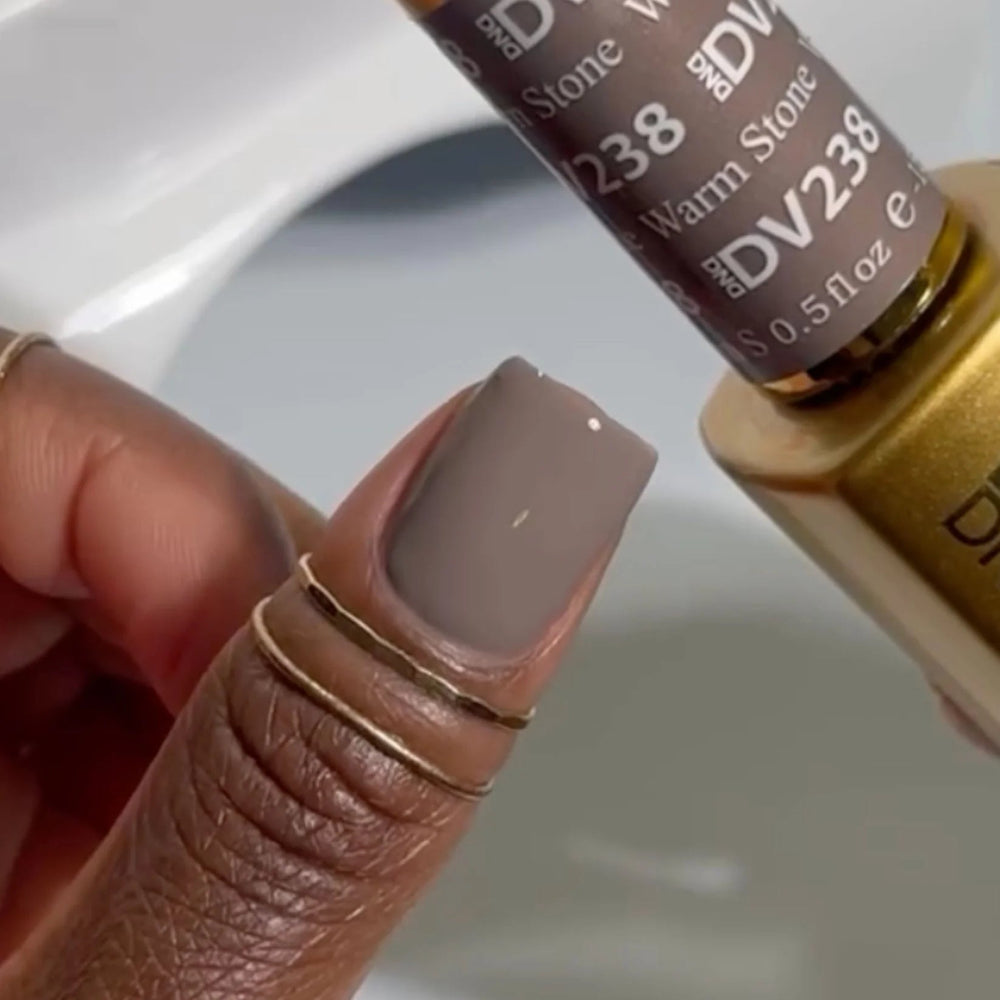 hands wearing 238 Warm Stone Diva Gel & Polish Duo by DND