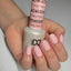 hands wearing DND Gel & Polish duo bottles 601 Dolce Pink (2)
