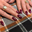 hands wearing DND Duos 629 Secret Plum gel polish