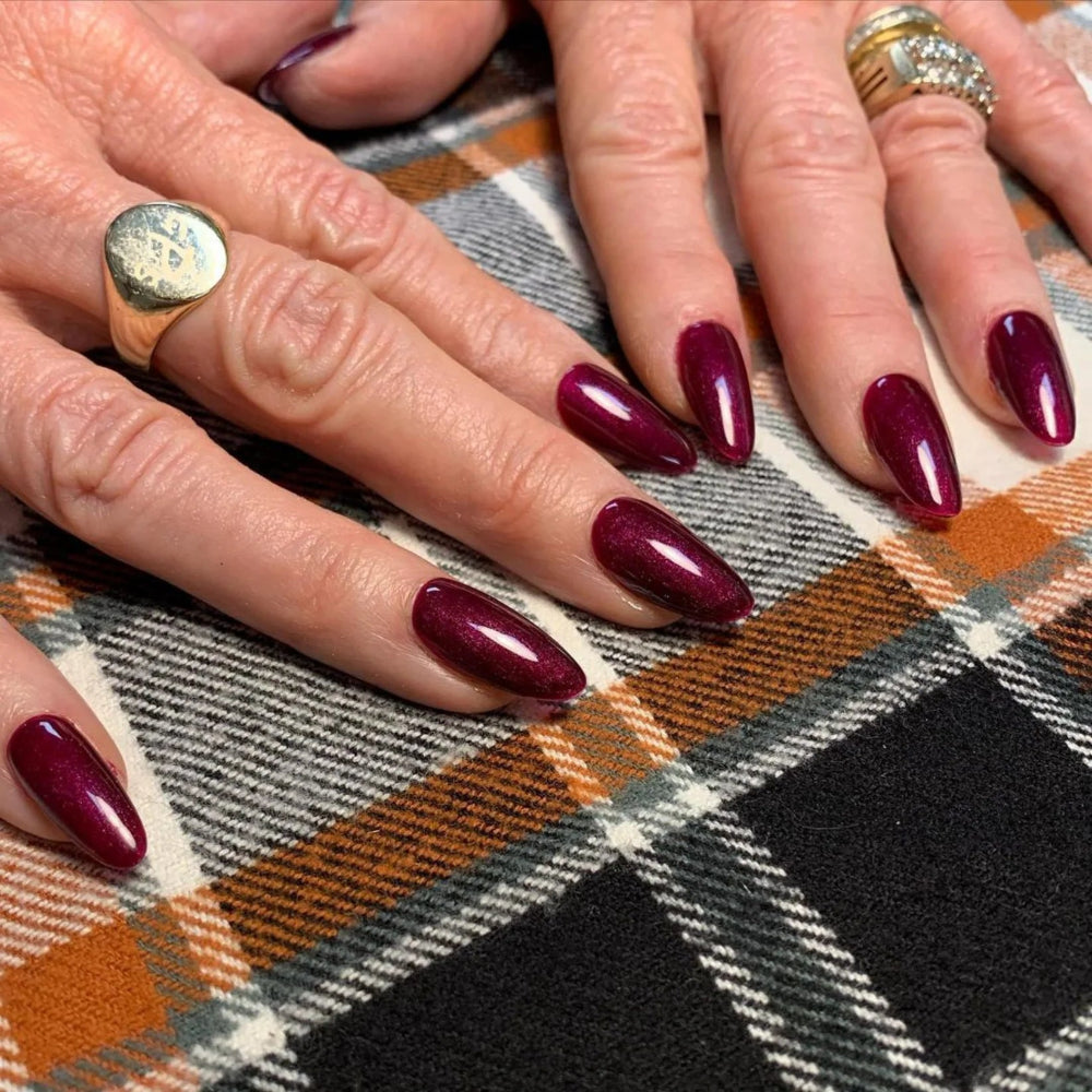 hands wearing DND Duos 629 Secret Plum gel polish