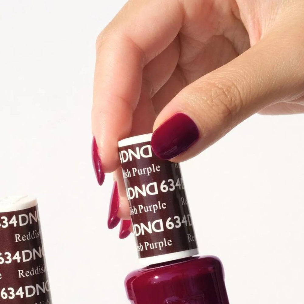 hand wearing DND Duo gel polish 634 Reddish Purple
